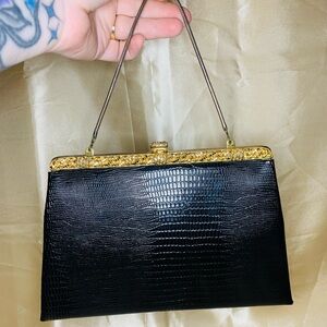 Vintage 1950s Evening Purse
Gold toned hardware, with small coin purse